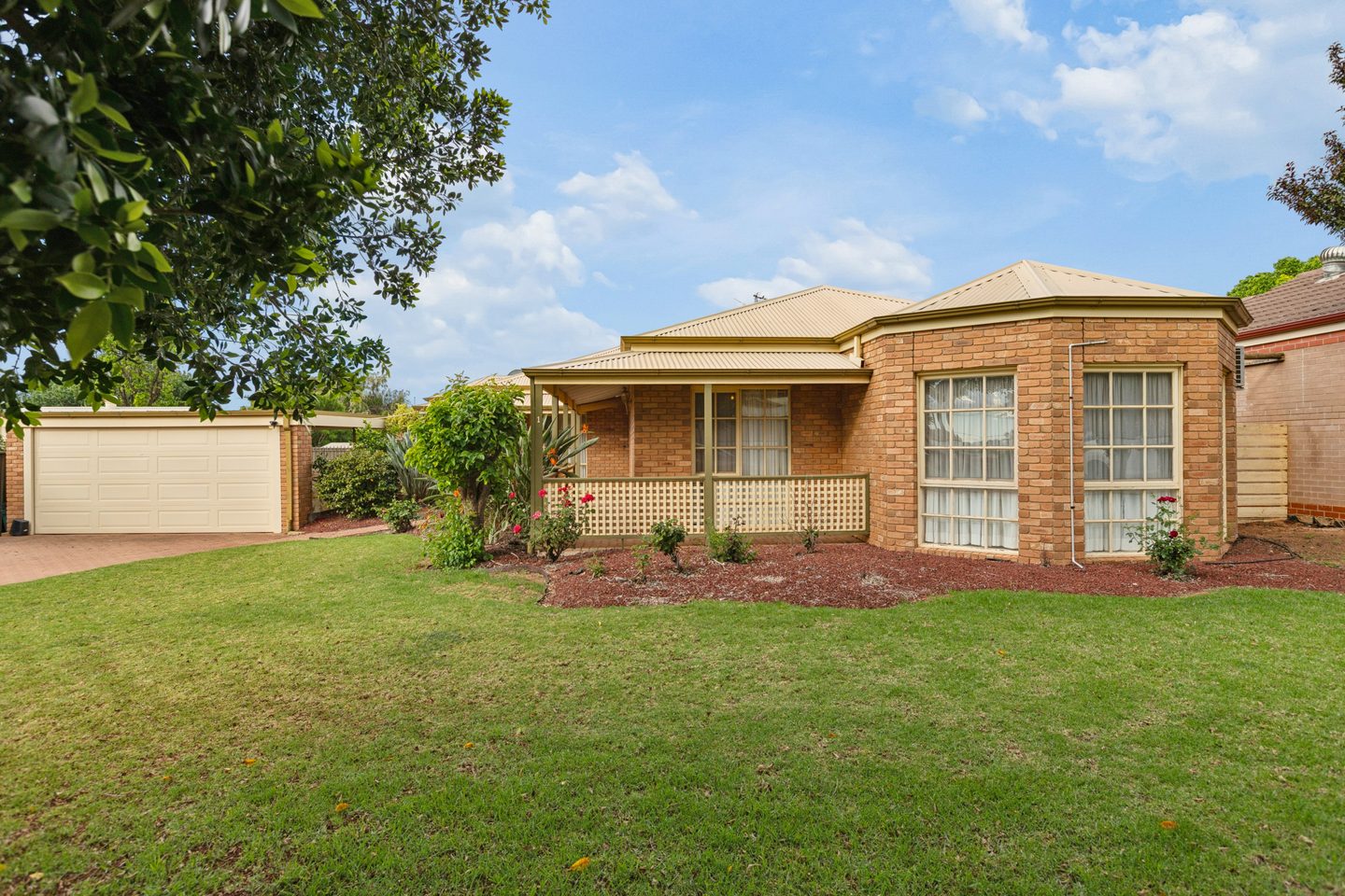 The brick frontage and garden